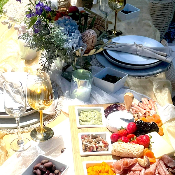 Freshly prepared picnic food platter with styled picnic table setup at Carlton Gardens Freshly prepared picnic food platter by RSSandwiches, picnic setup styled by Create Your Date at Carlton Gardens